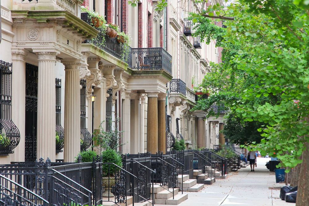 Residential brownstone buildings on a Manhattan street